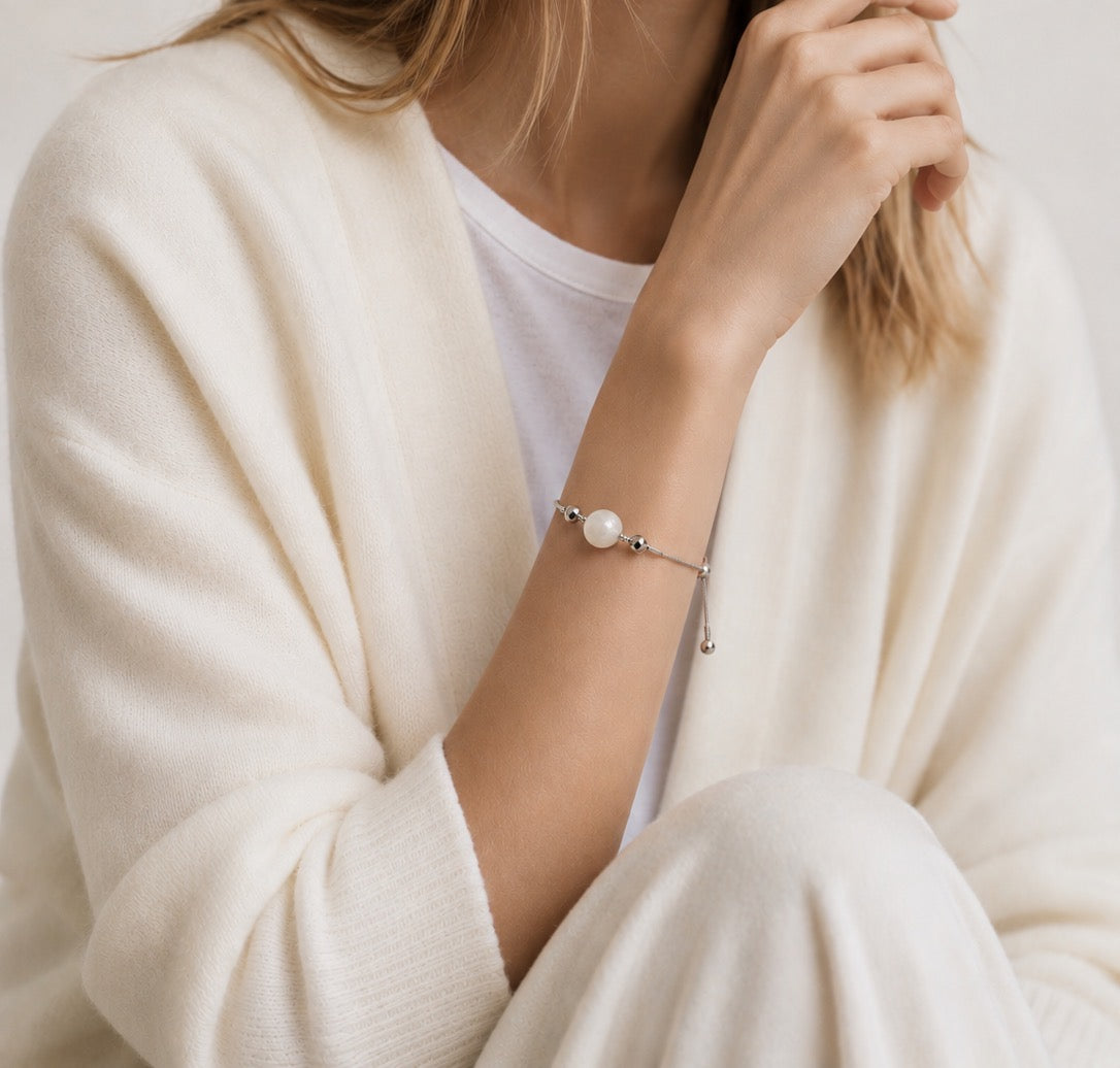 Model with White Jade bead bracelet with magnetic interchangeable charm on titanium steel chain